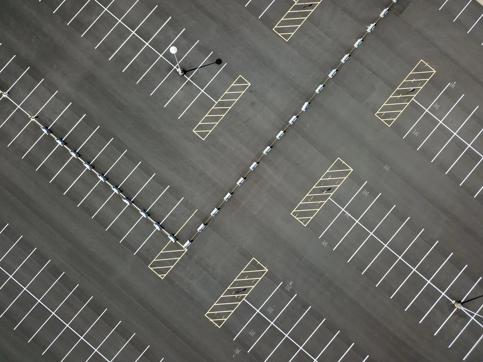 Aerial view of a parking lot with painted markings