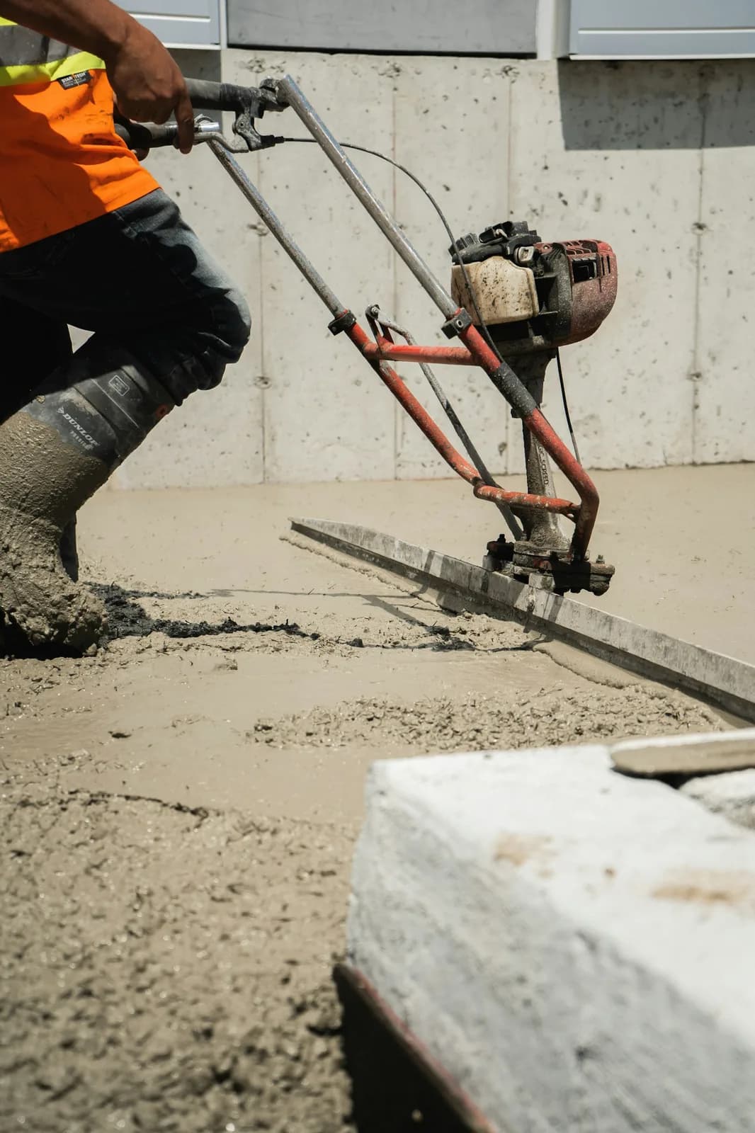Screeding a wet concrete pour