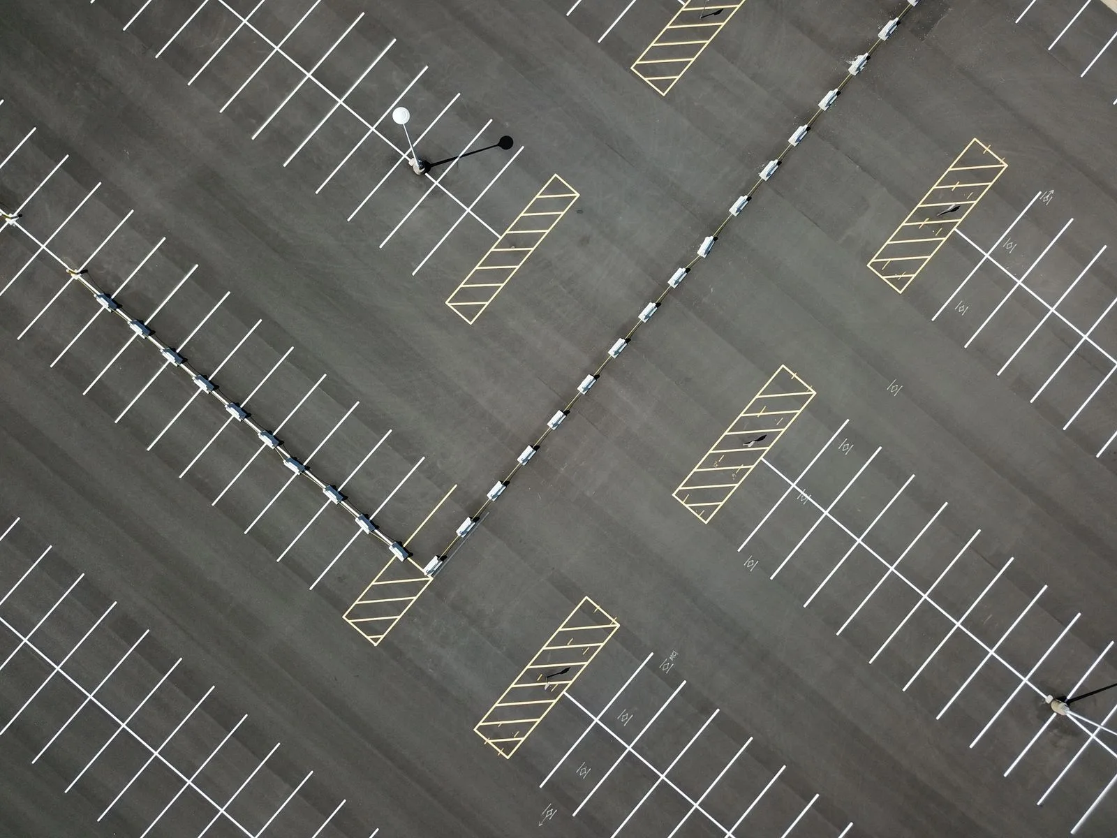Aerial view of a parking lot with painted markings